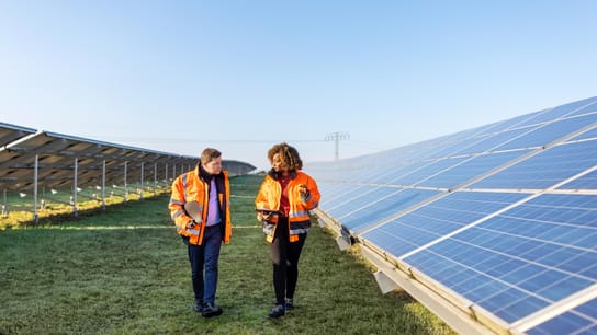 Engineers working at solar power plant.