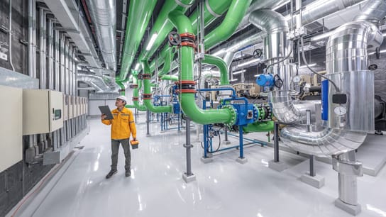 Male engineer working at pipeline zone of oil and gas industrial.