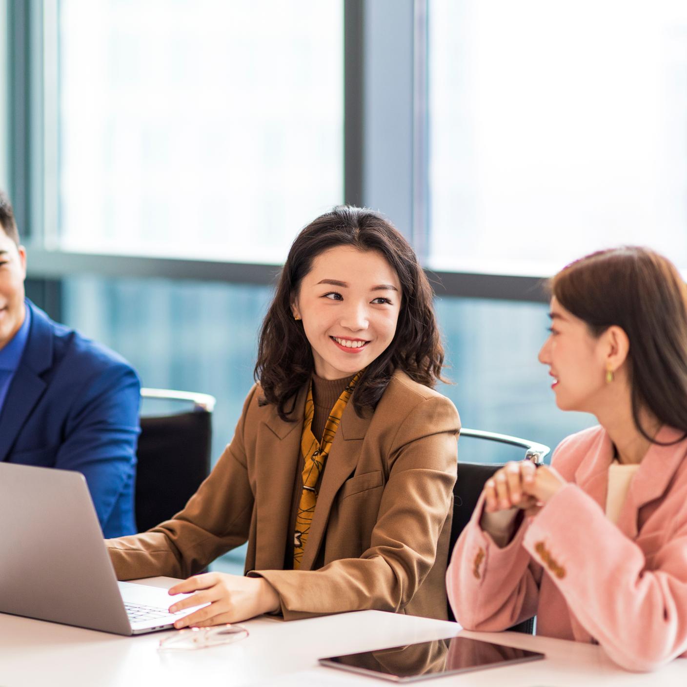 Women discussing in office