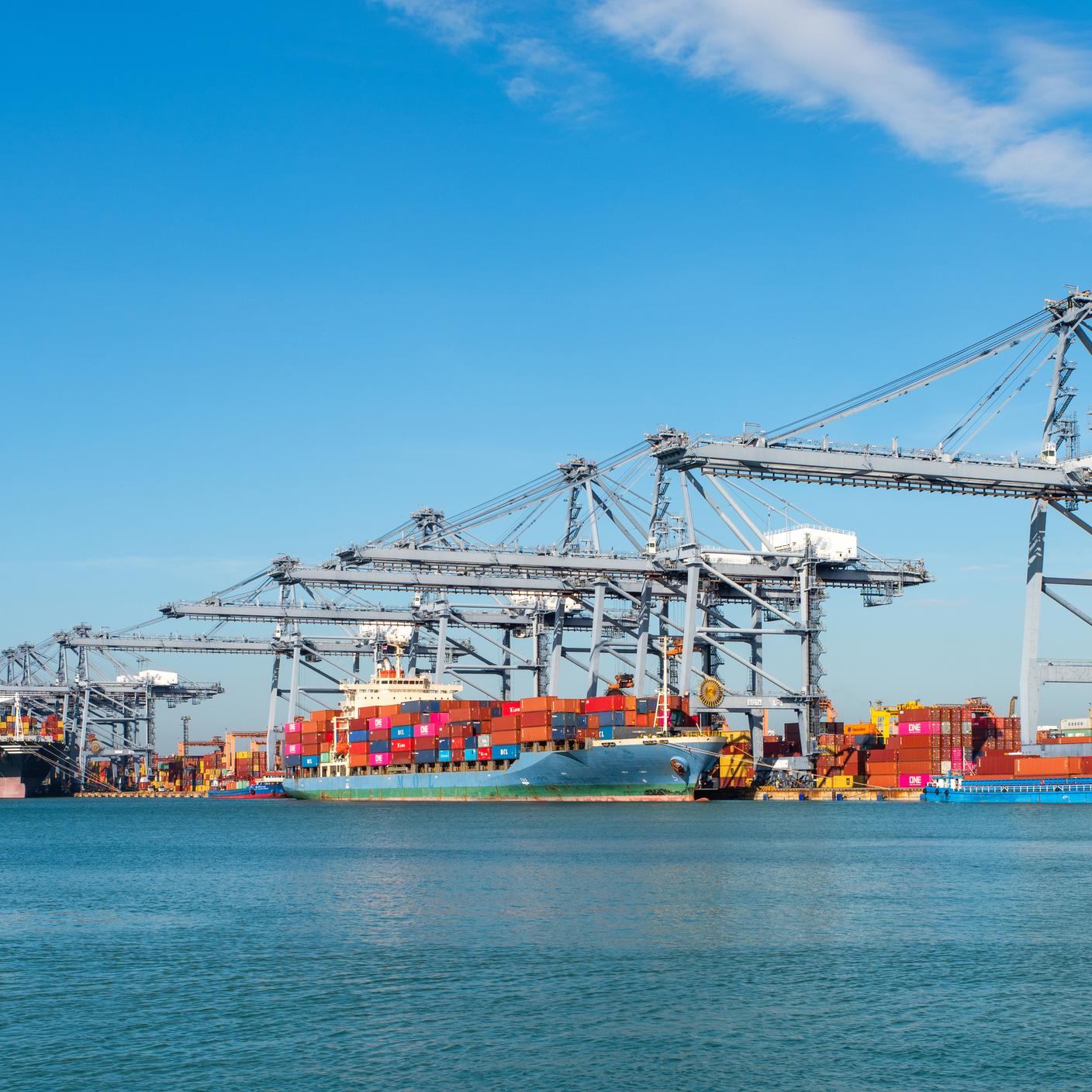 Image for Standards Partnership programme, to be used across marketing communications including event materials, social media, website etc. Container ship loading and unloading in sea port, aerial view of business logistic import and export freight transportation by container ship in harbor, container loading Cargo freight ship.