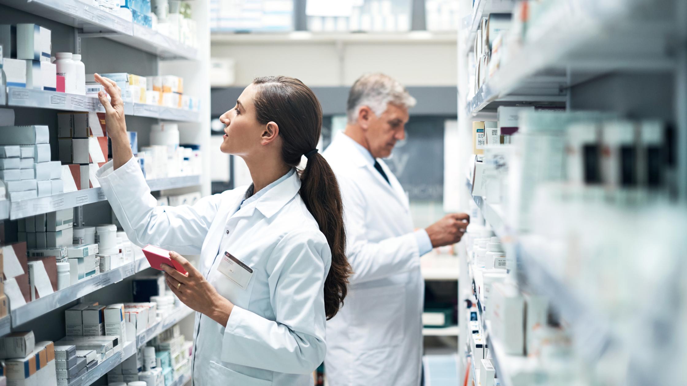 PSCI -  Two pharmacists checking products while working together in a dispensary