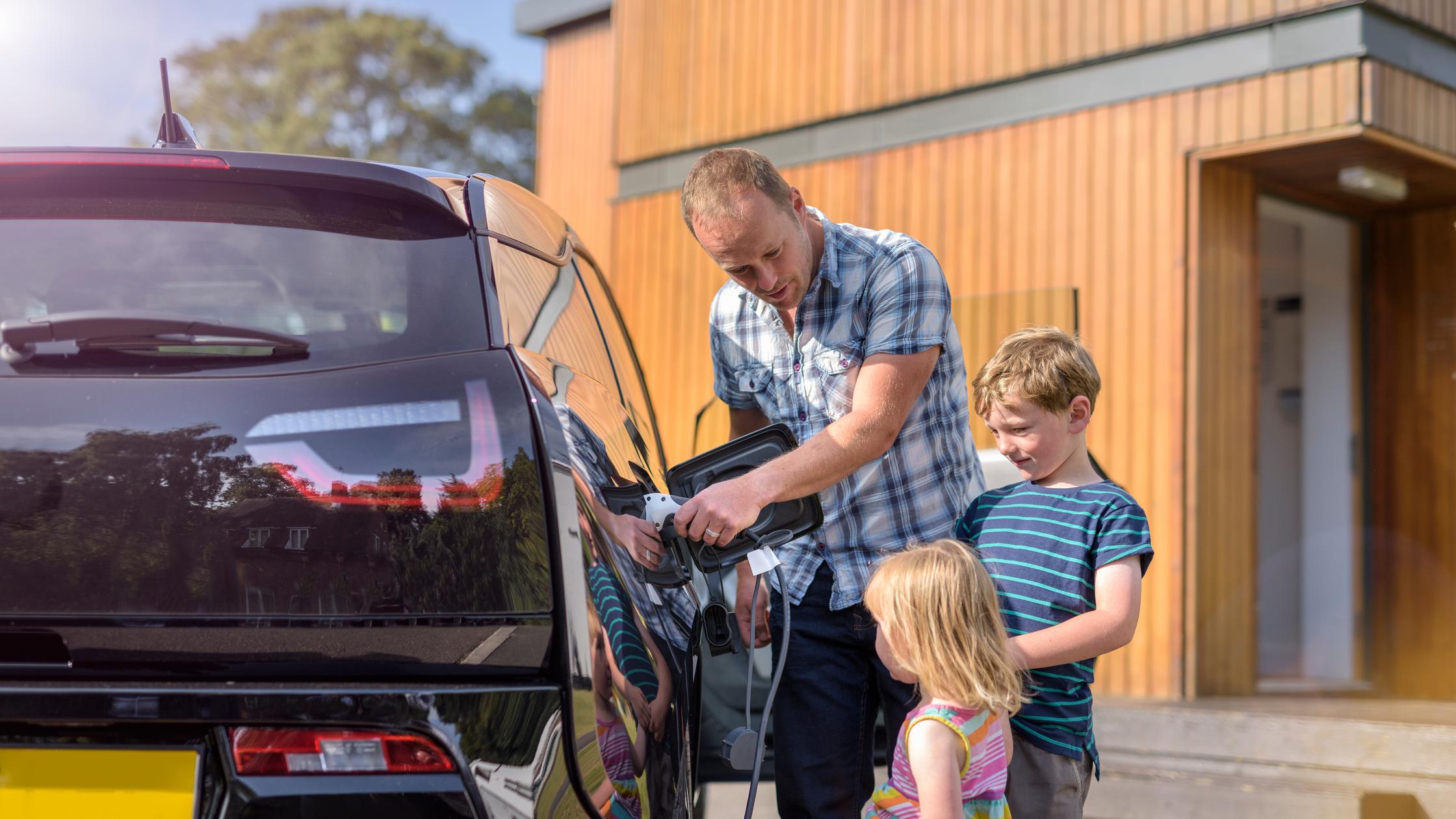 Family filling up car
