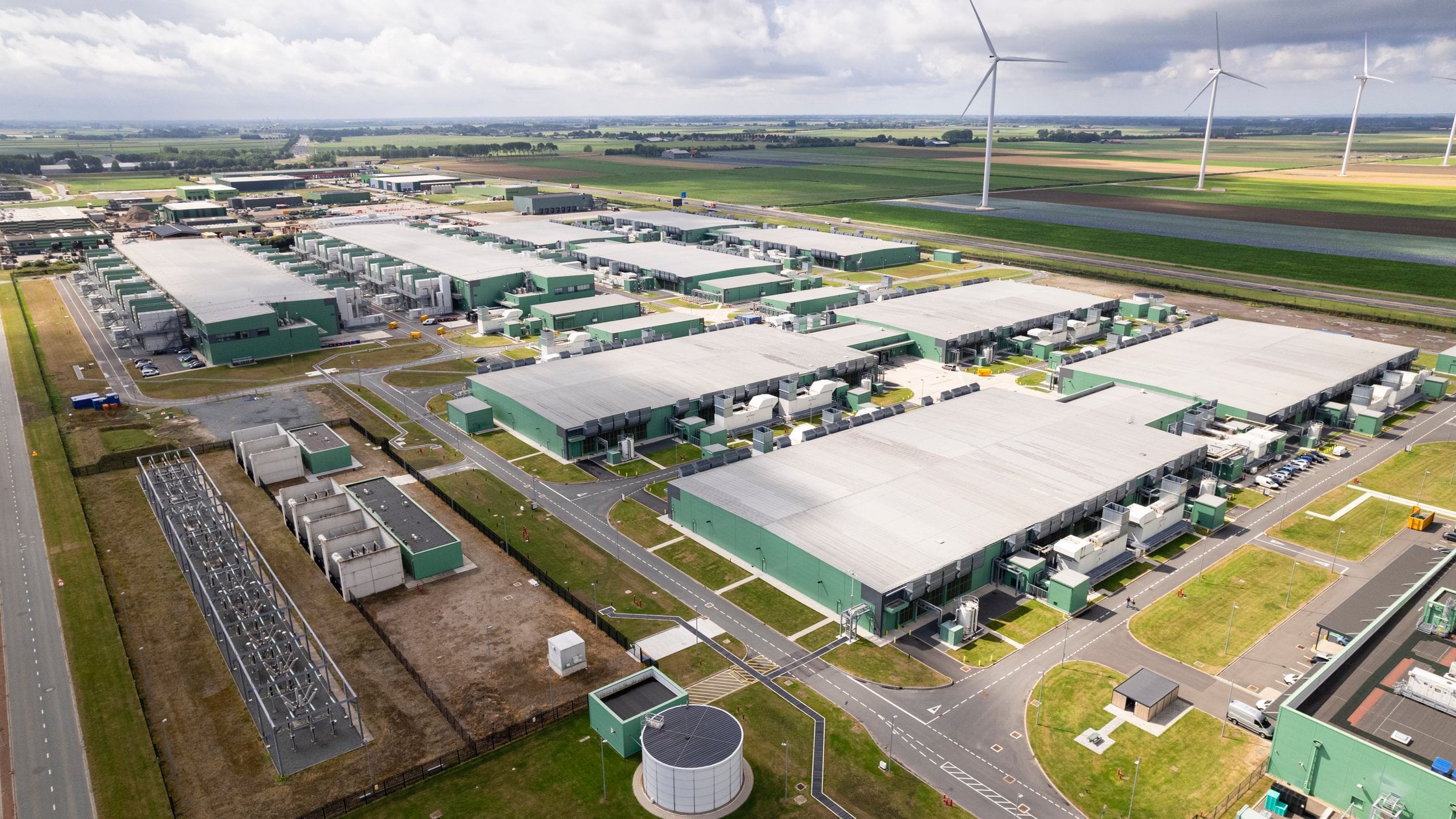 Horizontal color image of a data center from a drone point of view.